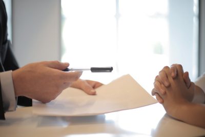 photo of signing paperwork for optional benefits