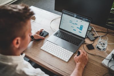 photo of an individual at a computer.