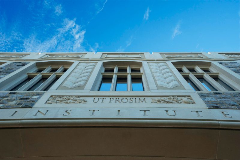 Scenic photo of campus showing Ut Prosim wording